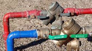 What causes backflow in plumbing